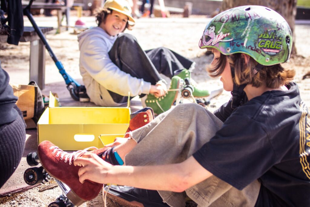 Kids Boys Putting On Skates